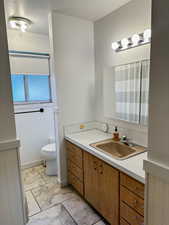 Full bathroom featuring vanity, a shower with shower curtain, and light tile patterned floors