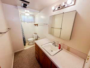 Bathroom with vanity and a shower with curtain