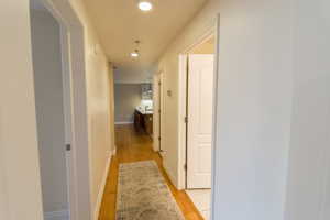 Corridor featuring recessed lighting and light wood-style floors