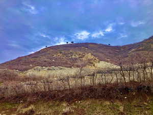 View of mountain background featuring rural landscape from front foor