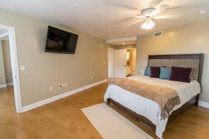 Bedroom with light wood-type flooring and ceiling fan