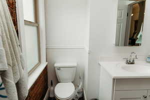 Bathroom featuring toilet and vanity