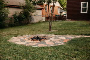 View of yard featuring an outdoor fire pit
