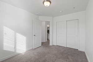 Second floor spare bedroom featuring carpet floors and light paint