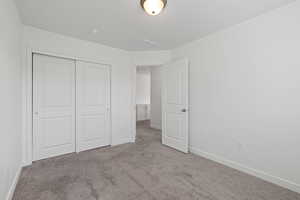 Second floor spare bedroom featuring carpet floors and light paint