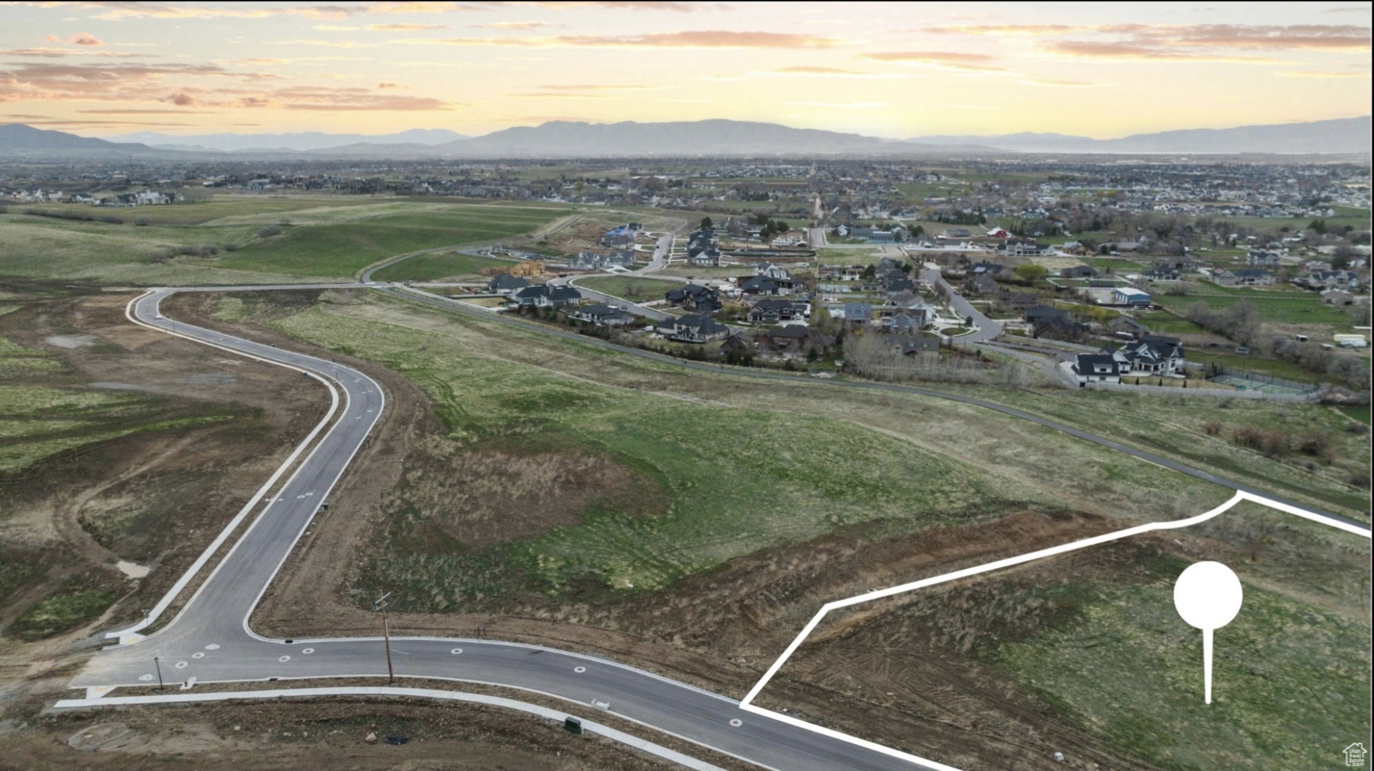 Aerial view at dusk of a mountain view and a residential view