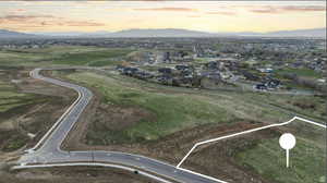 Aerial view at dusk of a mountain view and a residential view