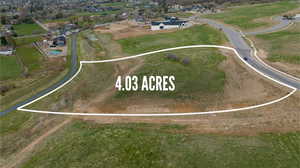 Aerial view of property and surrounding area with property parcel outlined