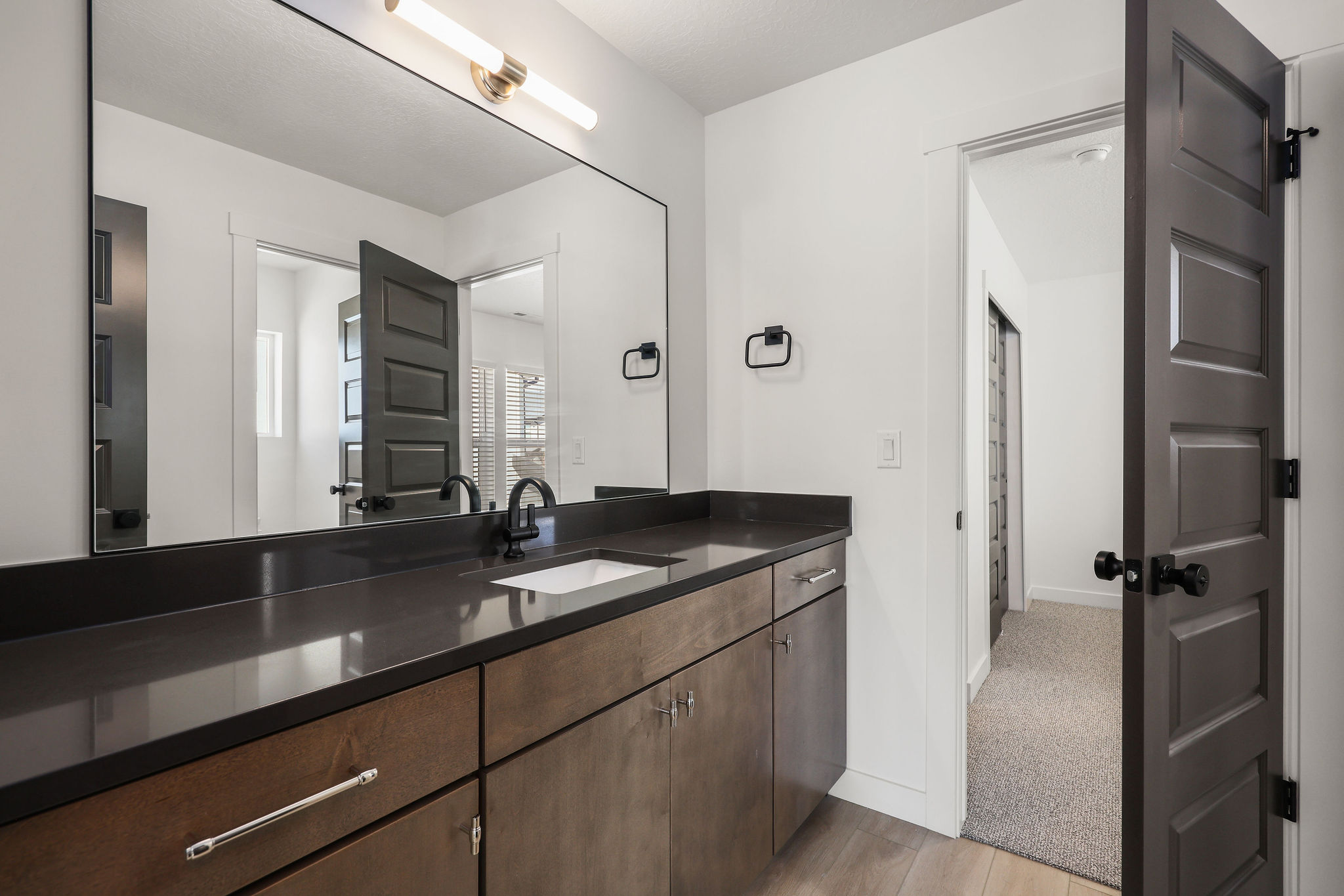 Bathroom featuring vanity and light wood-style floors