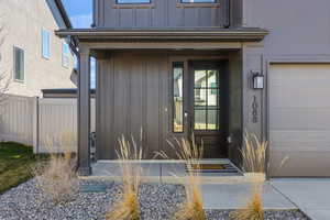 View of exterior entry with board and batten siding