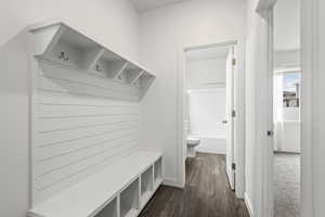 Mudroom with dark wood-type flooring