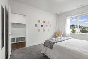 Bedroom with carpet and baseboards