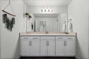 Bathroom featuring vanity and baseboards