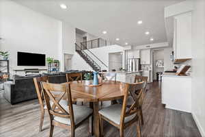 Dining room with recessed lighting and dark wood-type flooring