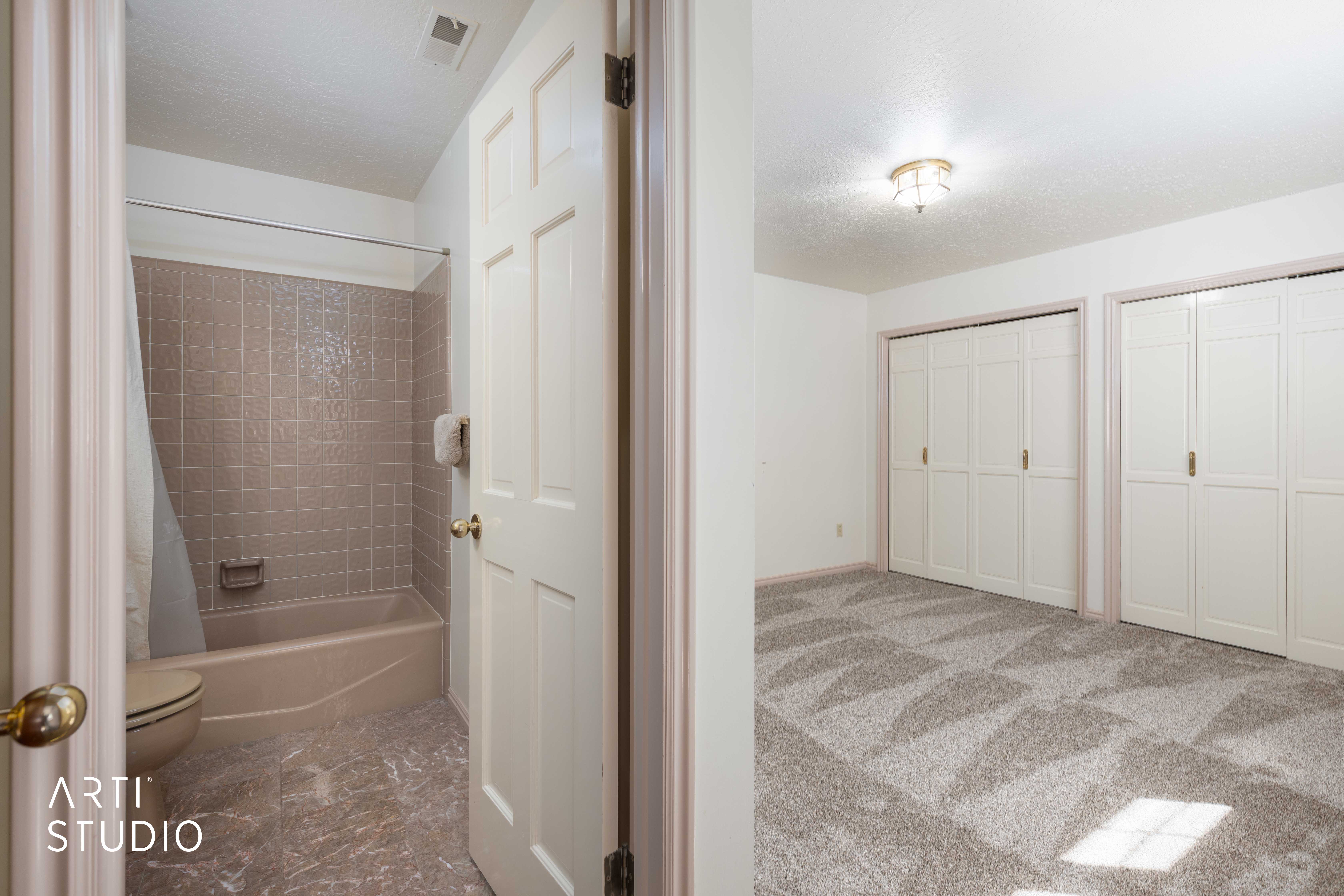 Bathroom featuring shower / tub combo with curtain and light colored carpet