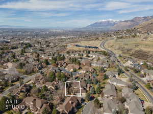 View of property location featuring a mountain backdrop and nearby suburban area