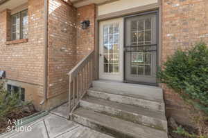 Property entrance with brick siding
