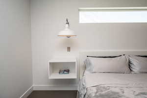 Bedroom featuring carpet floors and baseboards