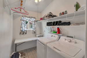 Laundry room featuring independent washer and dryer and light flooring