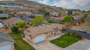 Aerial view of residential area featuring a mountainous background