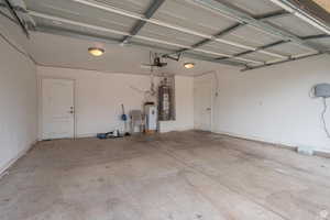 Garage featuring gas water heater
