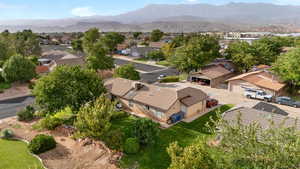 Aerial perspective of suburban area featuring a mountain backdrop