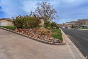 Community sign with a residential view and a mountain view