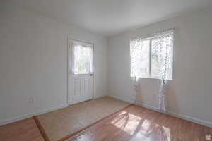 Foyer featuring light wood-style floors