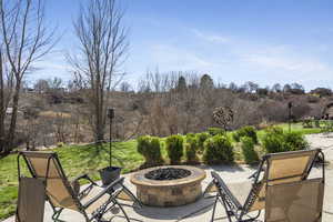 View of patio / terrace with an outdoor fire pit