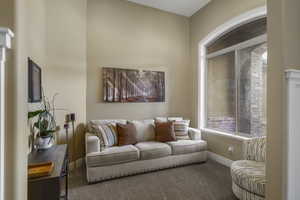 Living area with carpet floors and baseboards