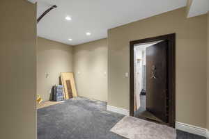 empty room featuring recessed lighting and baseboards
