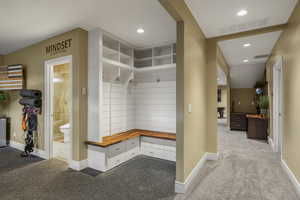 Mudroom with light carpet and recessed lighting