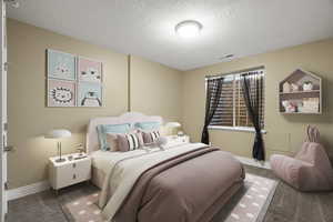 Carpeted bedroom with baseboards and a textured ceiling