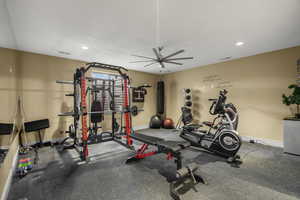 Exercise area with ceiling fan and recessed lighting