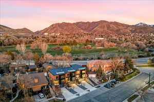 Bird's eye view of a mountainous background and a golf club