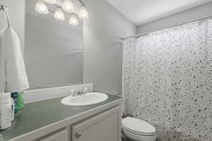 Bathroom with vanity and a shower with curtain