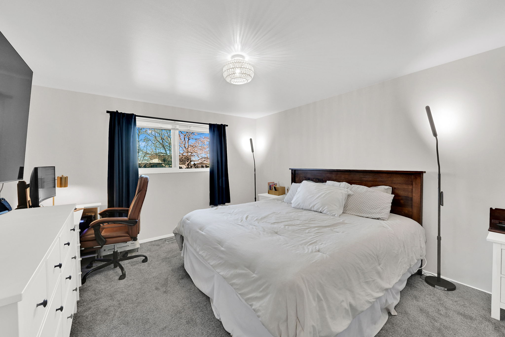 Bedroom with light colored carpet