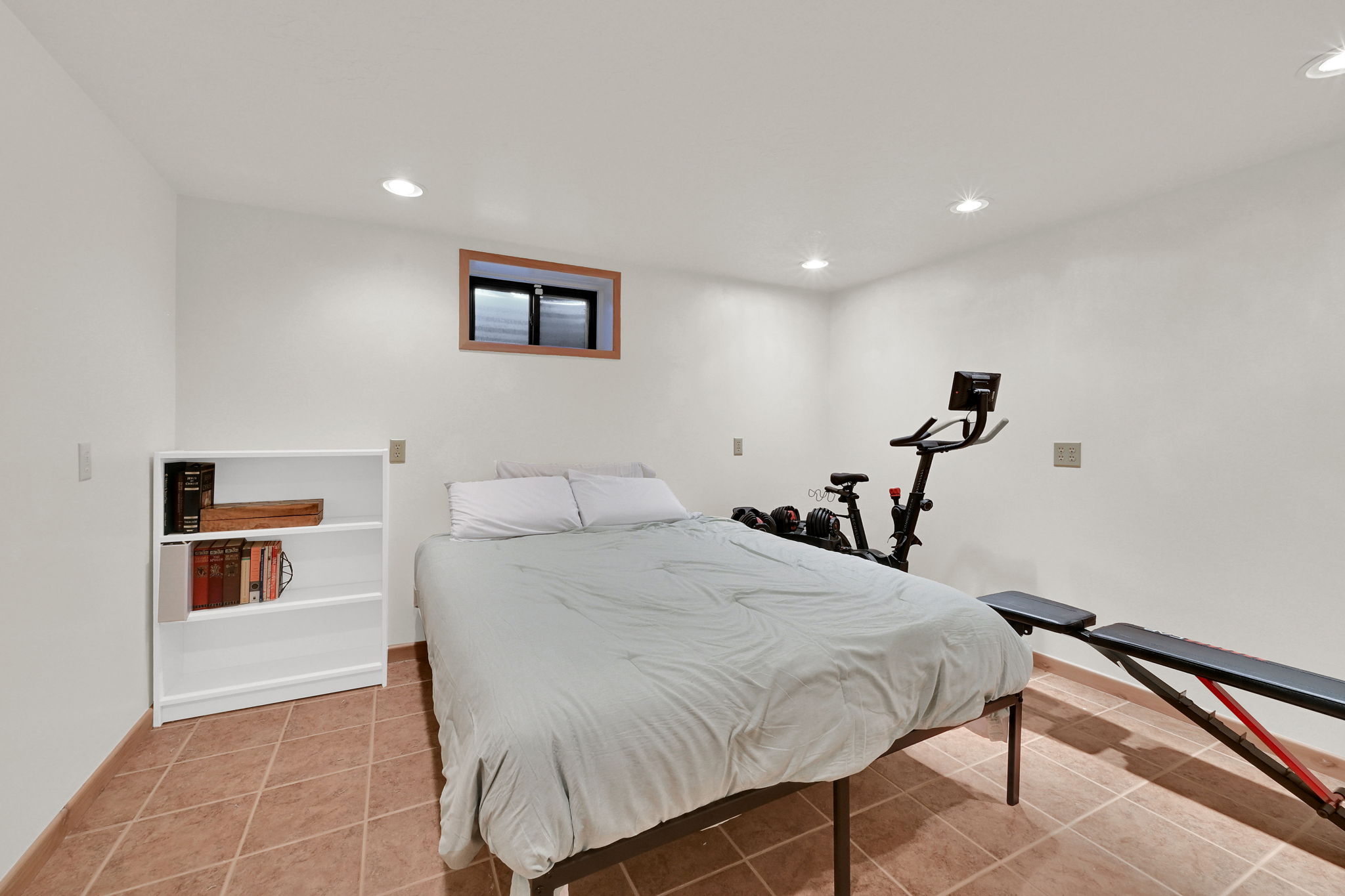 room with recessed lighting and light tile patterned floors