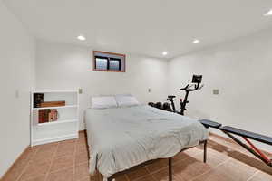 room with recessed lighting and light tile patterned floors