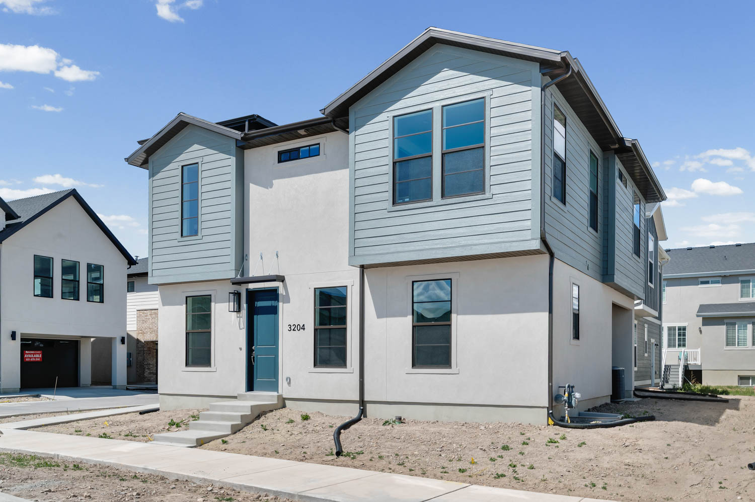 View of front of property featuring stucco siding