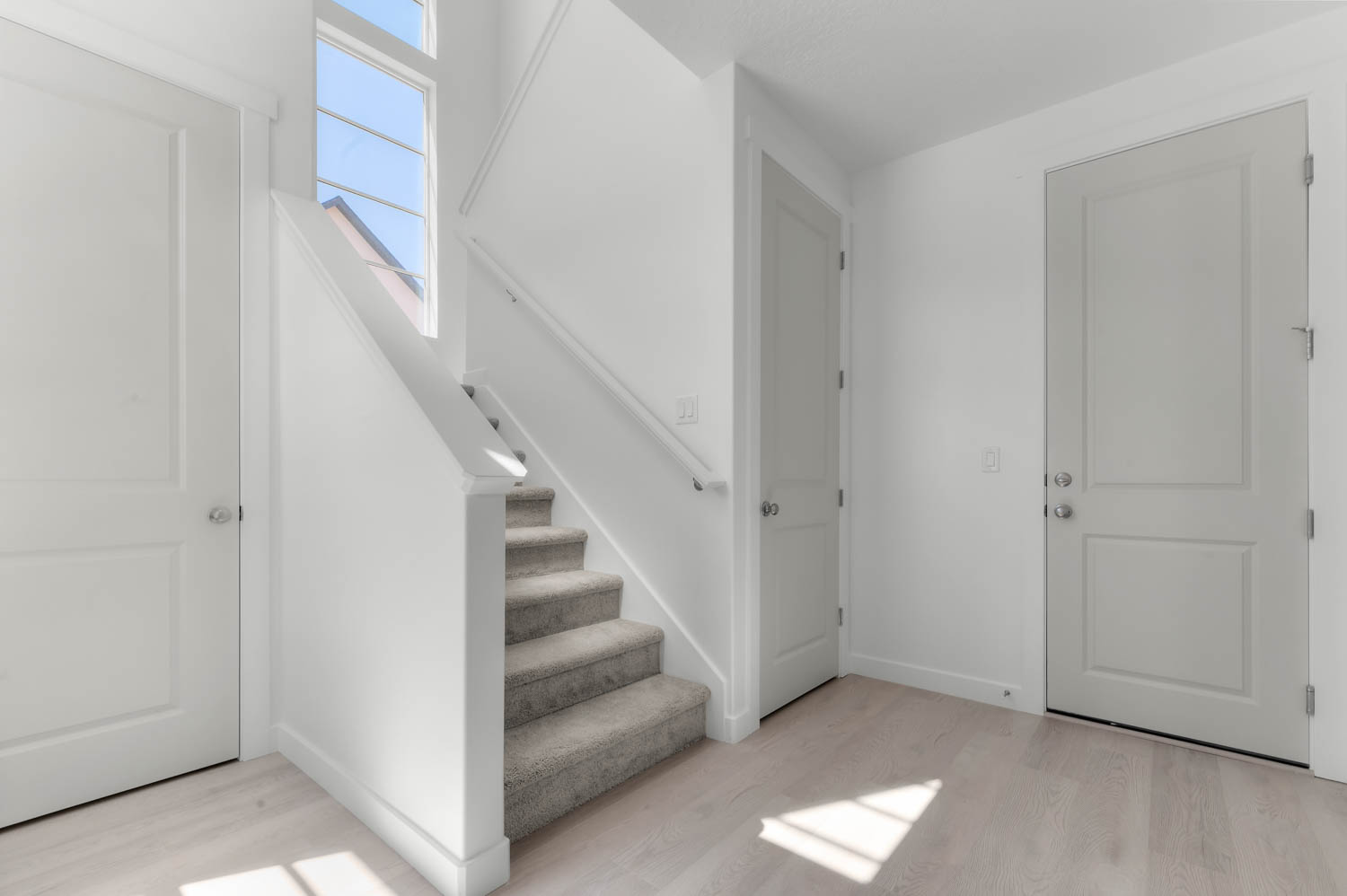 Staircase featuring wood finished floors
