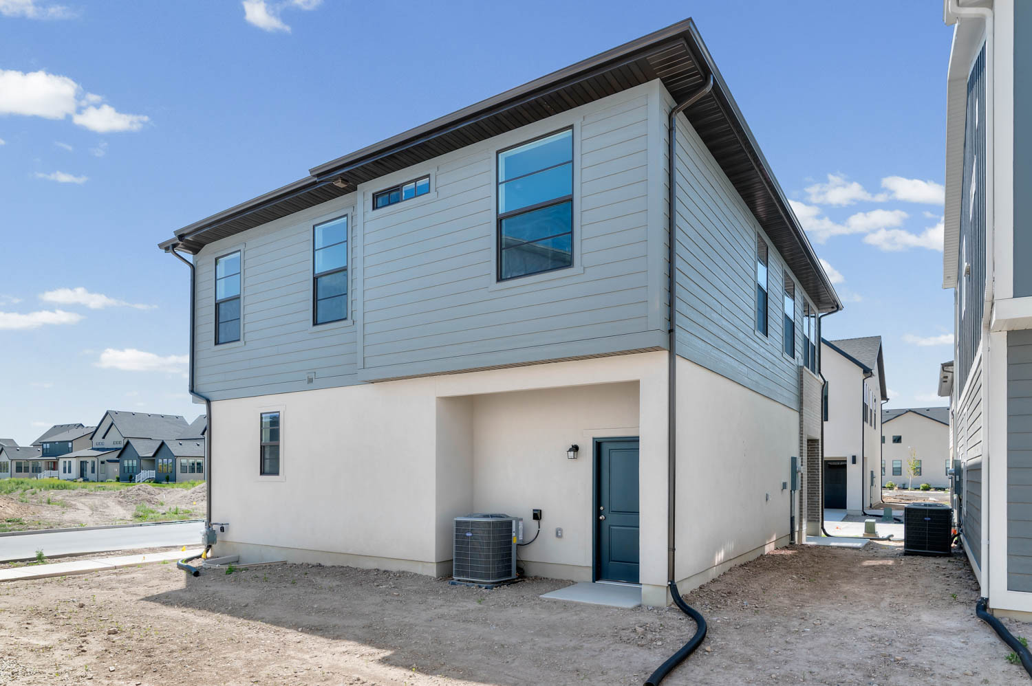 Rear view of property with a residential view