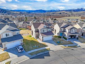 Aerial perspective of suburban area featuring a mountainous background