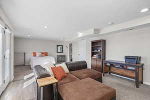 Bedroom featuring recessed lighting and light carpet