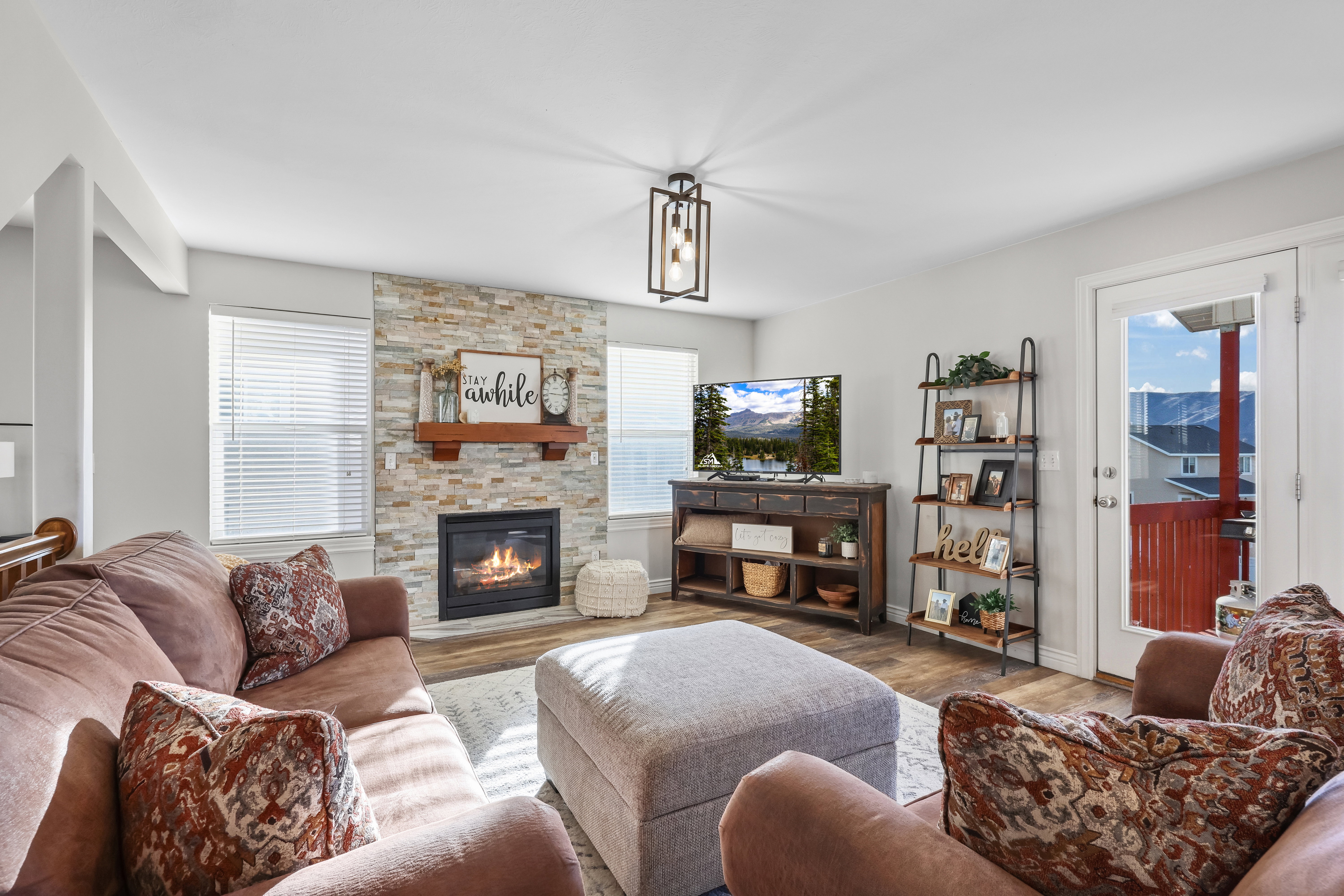 Living area featuring wood finished floors and a fireplace