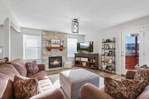 Living area featuring wood finished floors and a fireplace