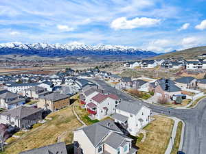 Aerial perspective of suburban area with a mountain backdrop