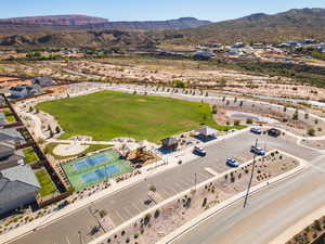 Aerial view of property's location with mountains and nearby suburban area
