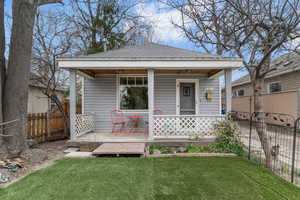 View of front of property featuring roof with shingles and covered porch