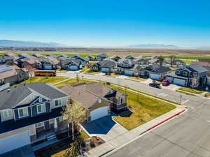 Aerial perspective of suburban area with a mountain backdrop